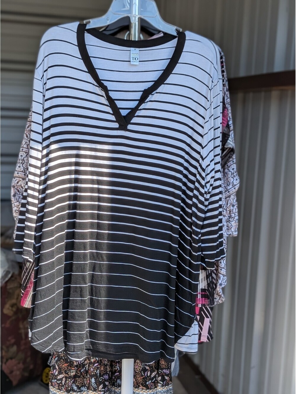T.O. black and white striped V-neck top